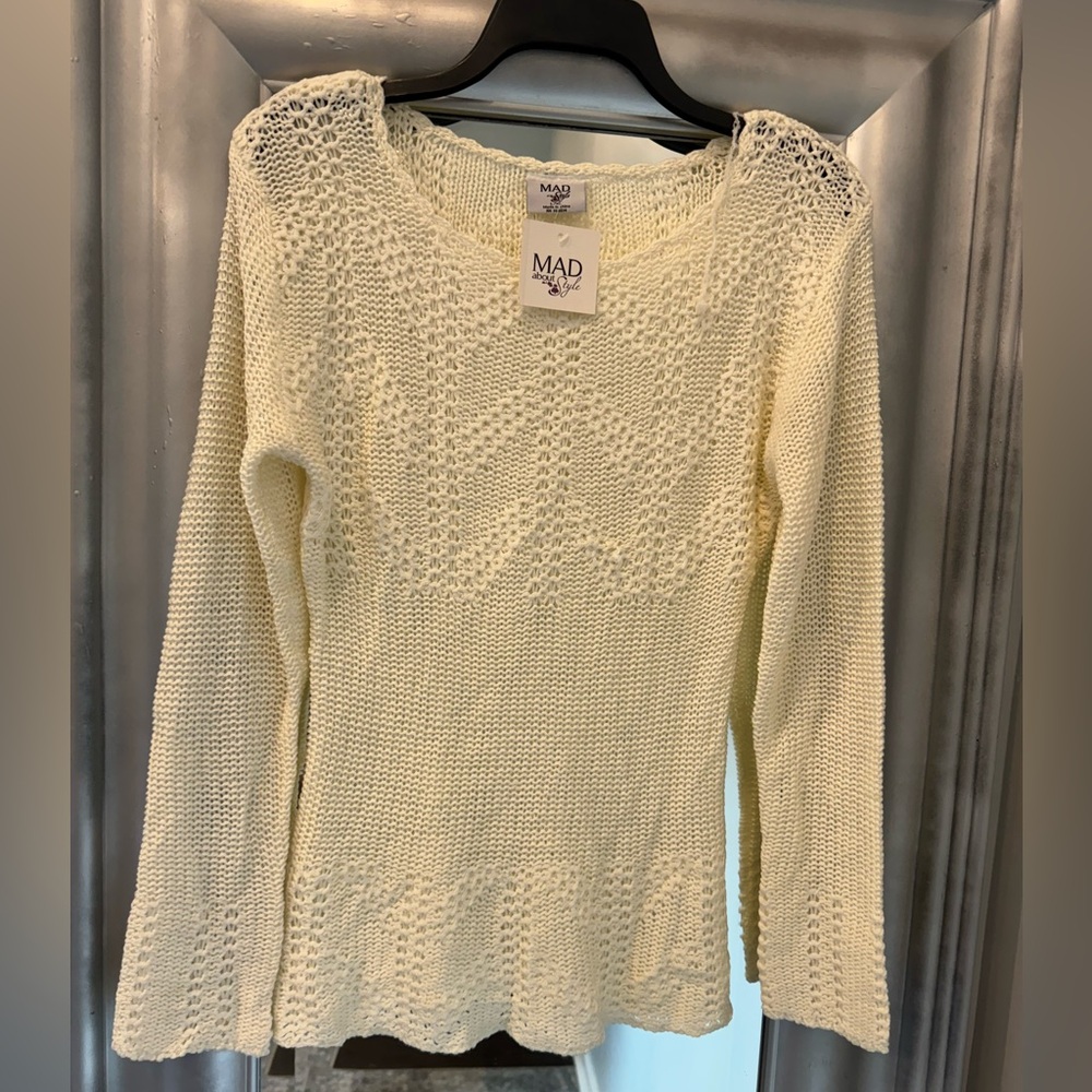This beautiful sweater is perfect for the fall- new- never worn!